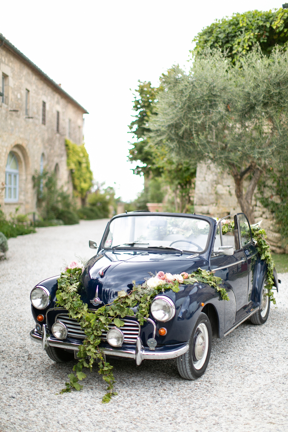 Navy Morris Minor decorated for a wedding