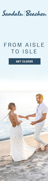 destination wedding couple on the beach in all white