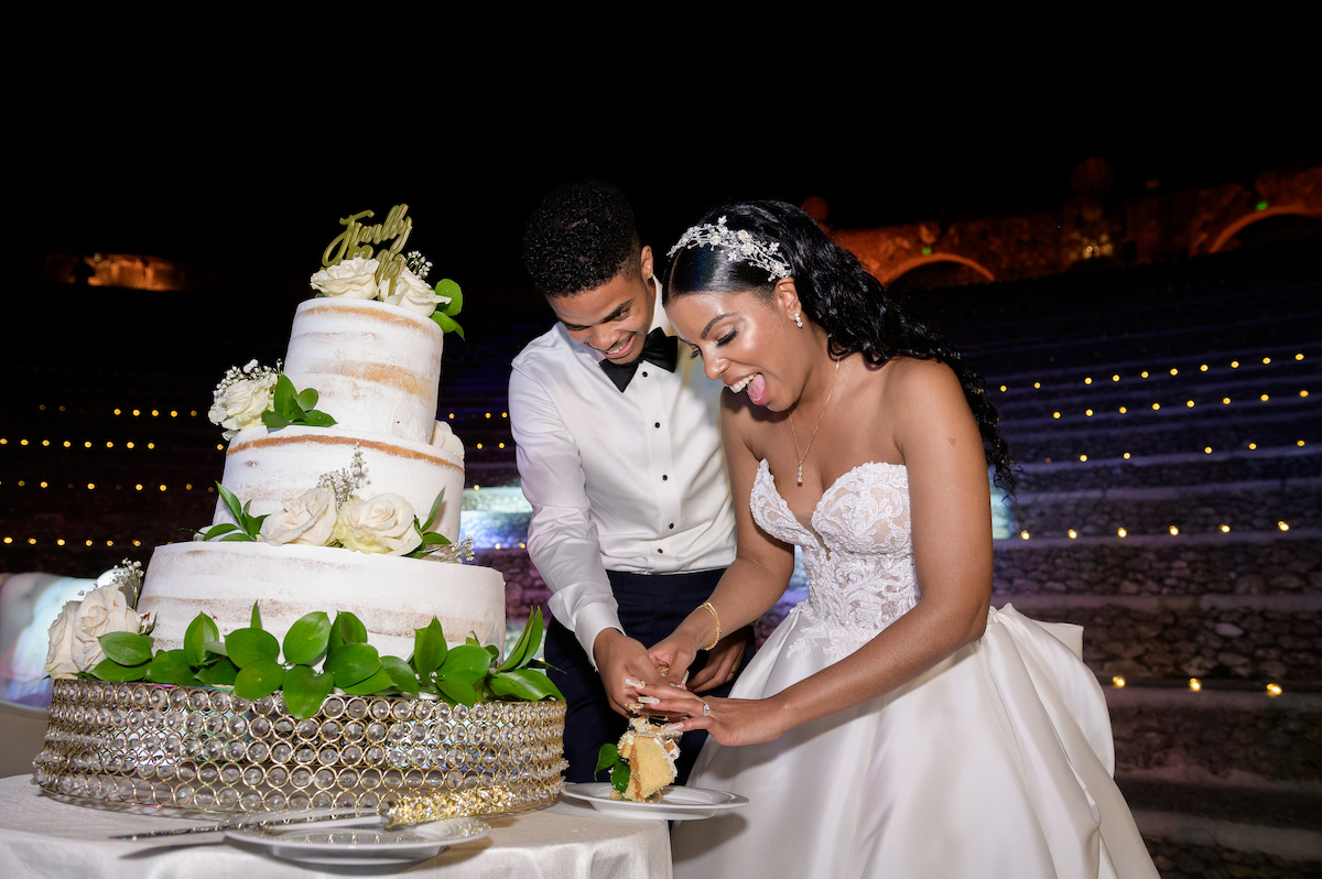 bride and groom cut cake in Dominican Republic amphitheater 