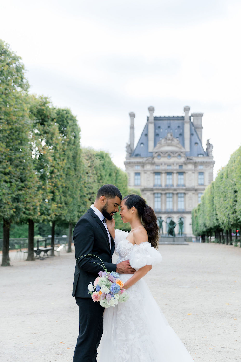 bride and groom in front of chateau