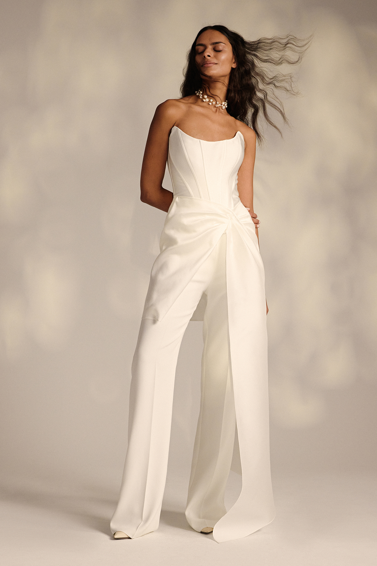 Bride in corsetted pantsuit wedding attire