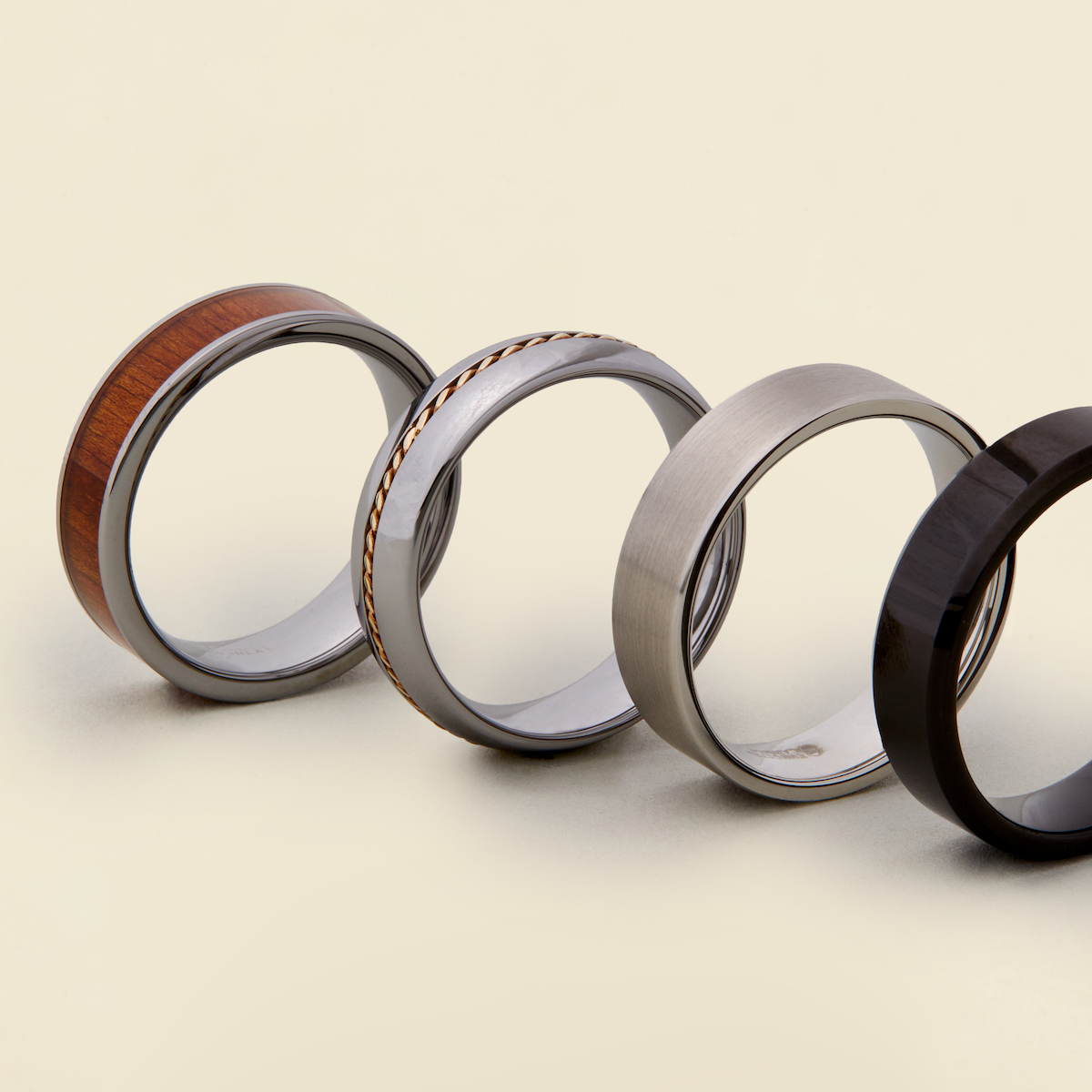 Four different styles of grooms wedding rings