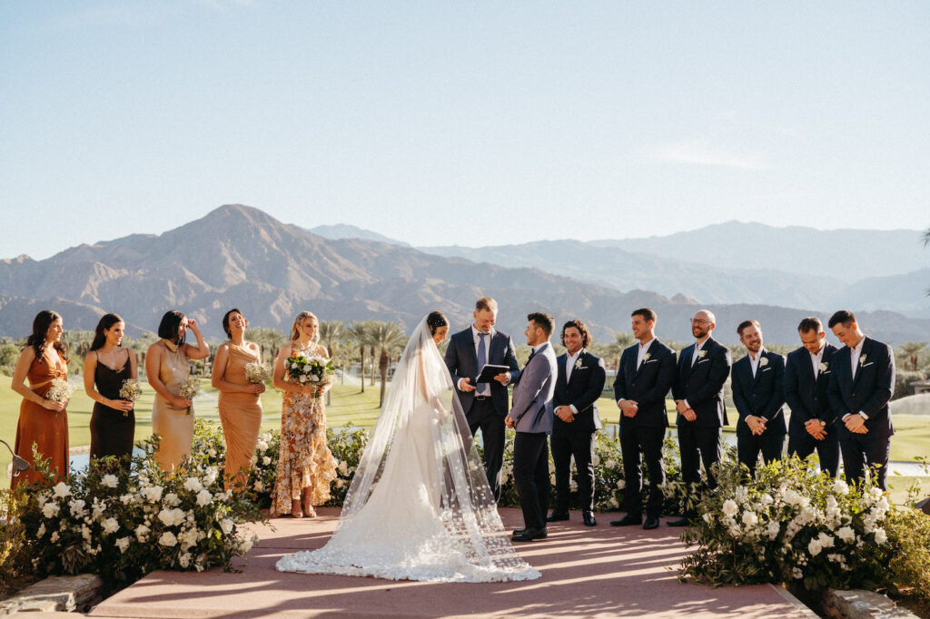 Golf course wedding ceremony overlooking mountains in Indian Wells, California