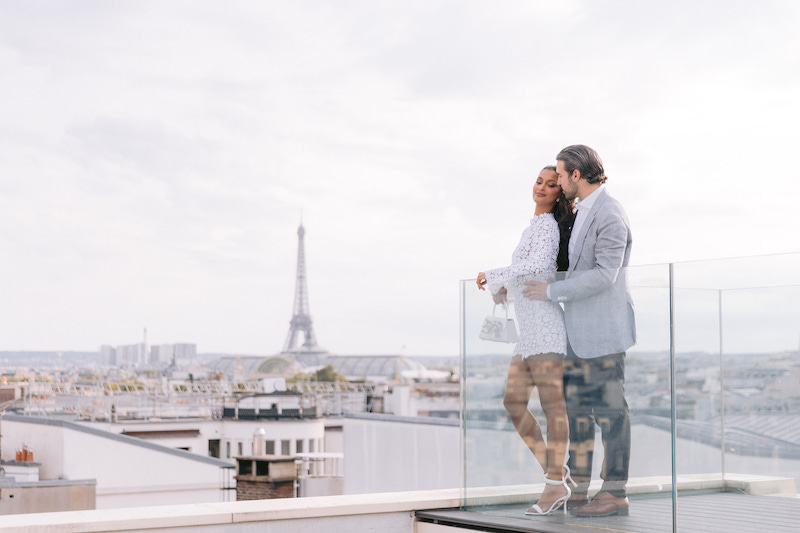 Engaged couple with Eiffel Tower in back