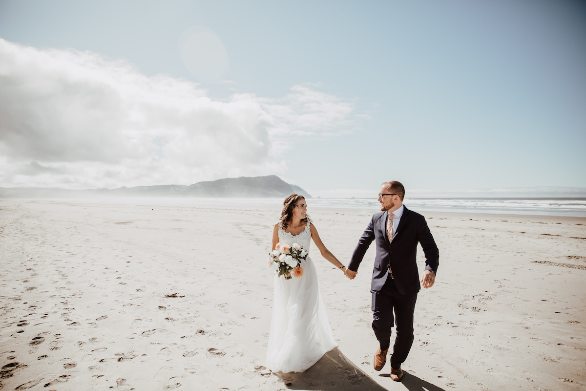 Wedding couple walking on beach