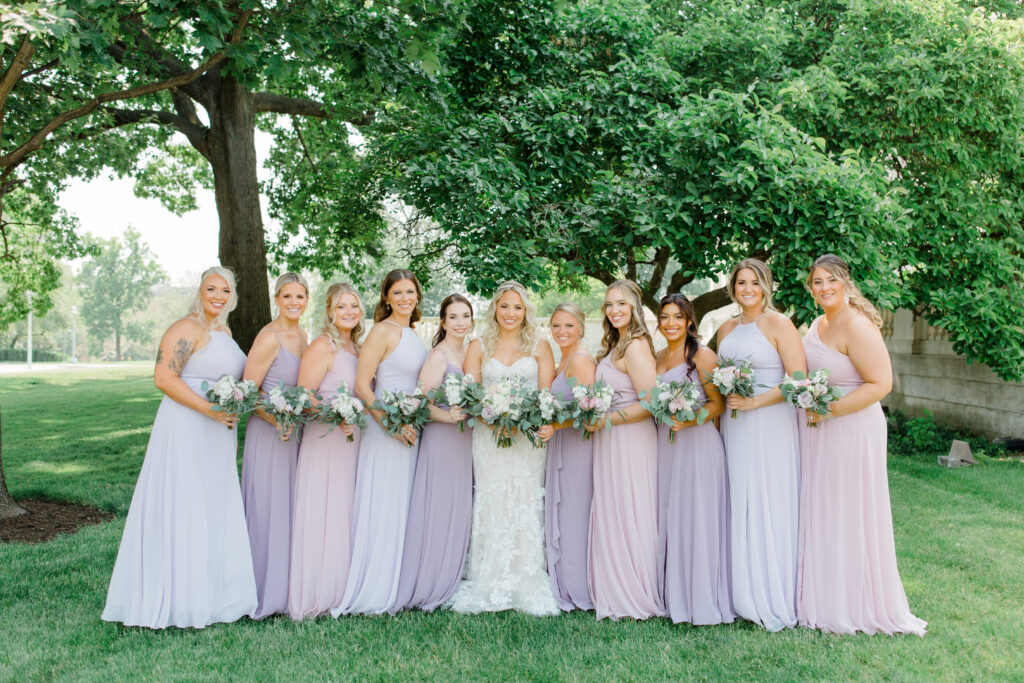 bride and bridesmaids in pastel gowns