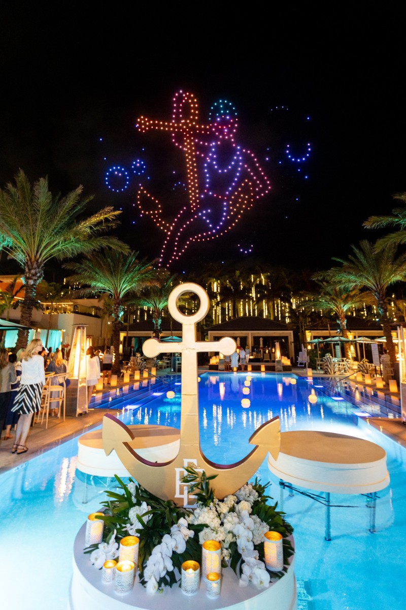 Nautical themed event with a drone show at a pool (wedding)