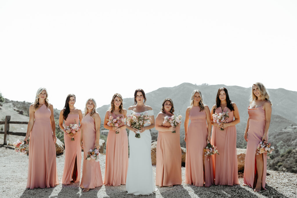 peach fuzz colored bridesmaid gowns