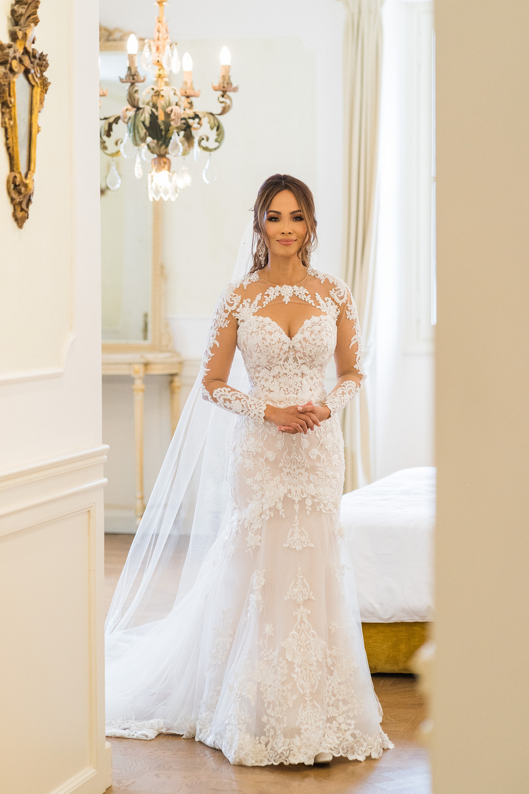 bride in lace applique gown