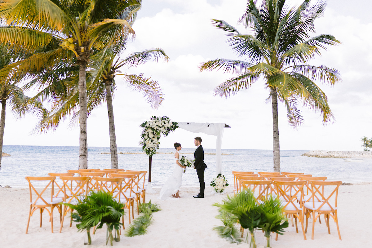 tropical beach wedding ceremony with bride and groom