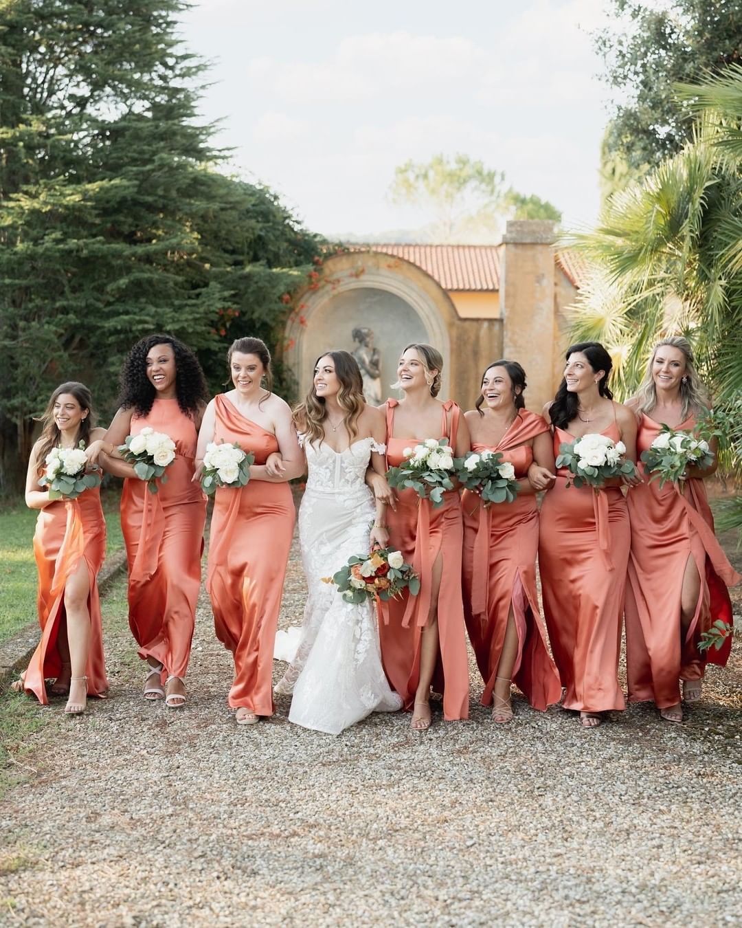 bridesmaids in mismatched styles in Terracotta Copper in Whisper Satin