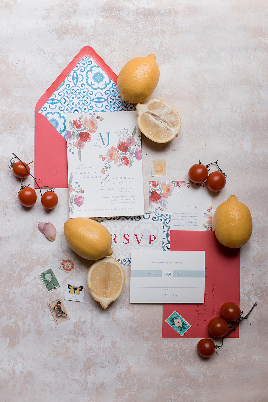 Bright wedding invitations framed by fresh fruits 
