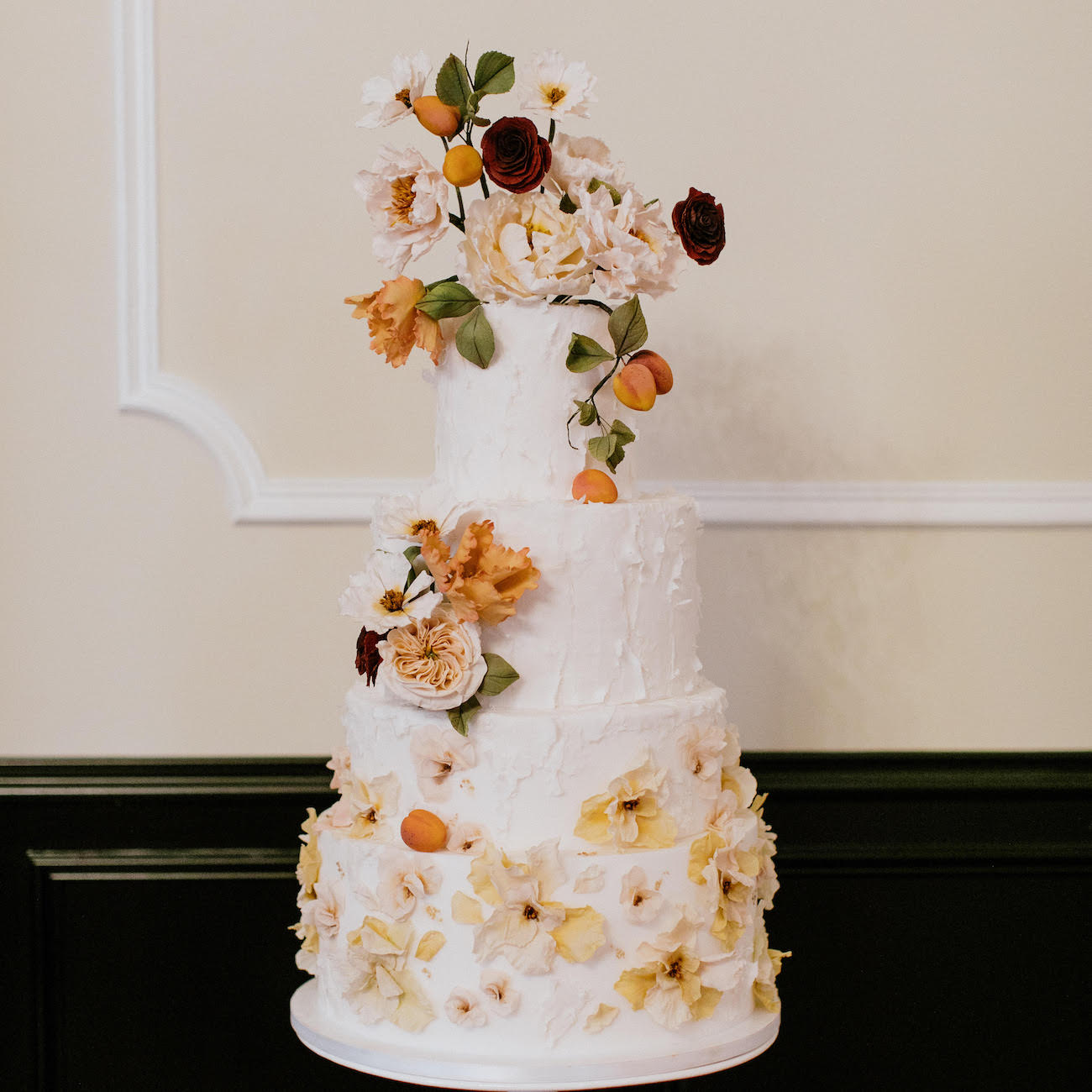 cake with organic details like florals and greenery
