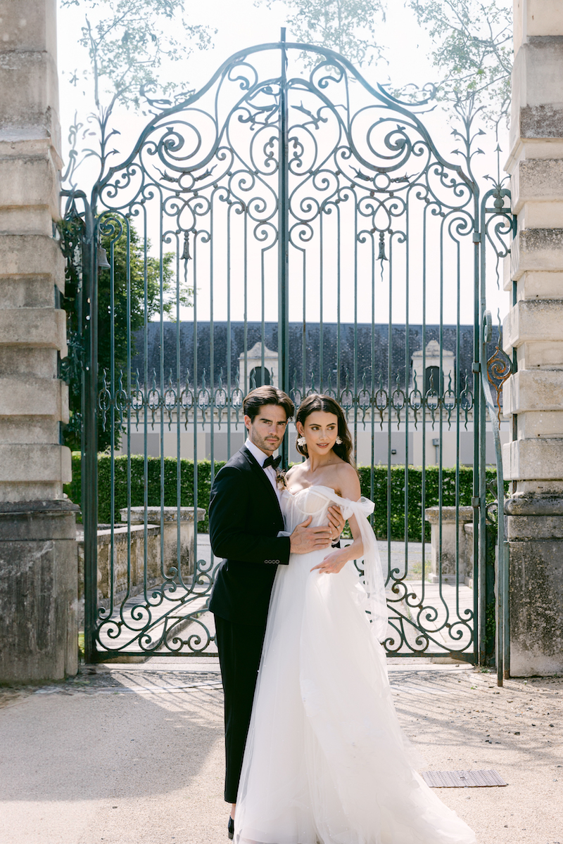 Wedding couple in front of castle gate