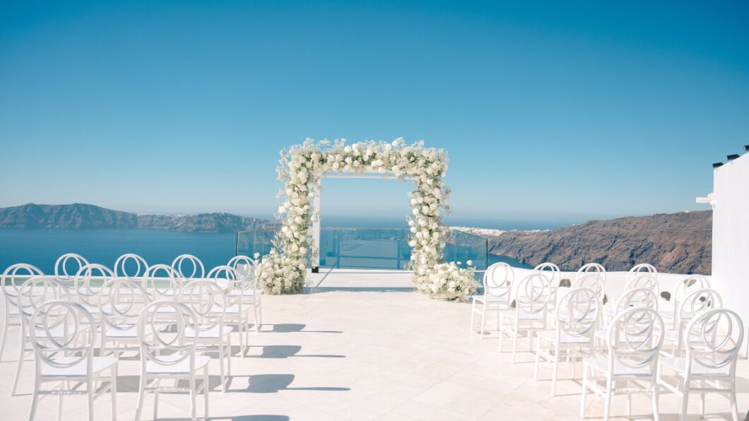 Santorini wedding ceremony with chairs and flowers