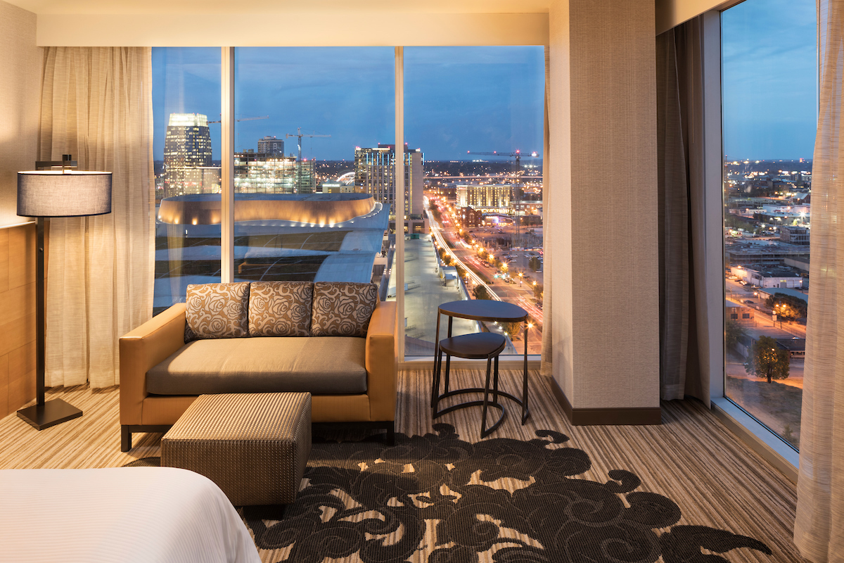 corner hotel suite with view of downtown Nashville at night