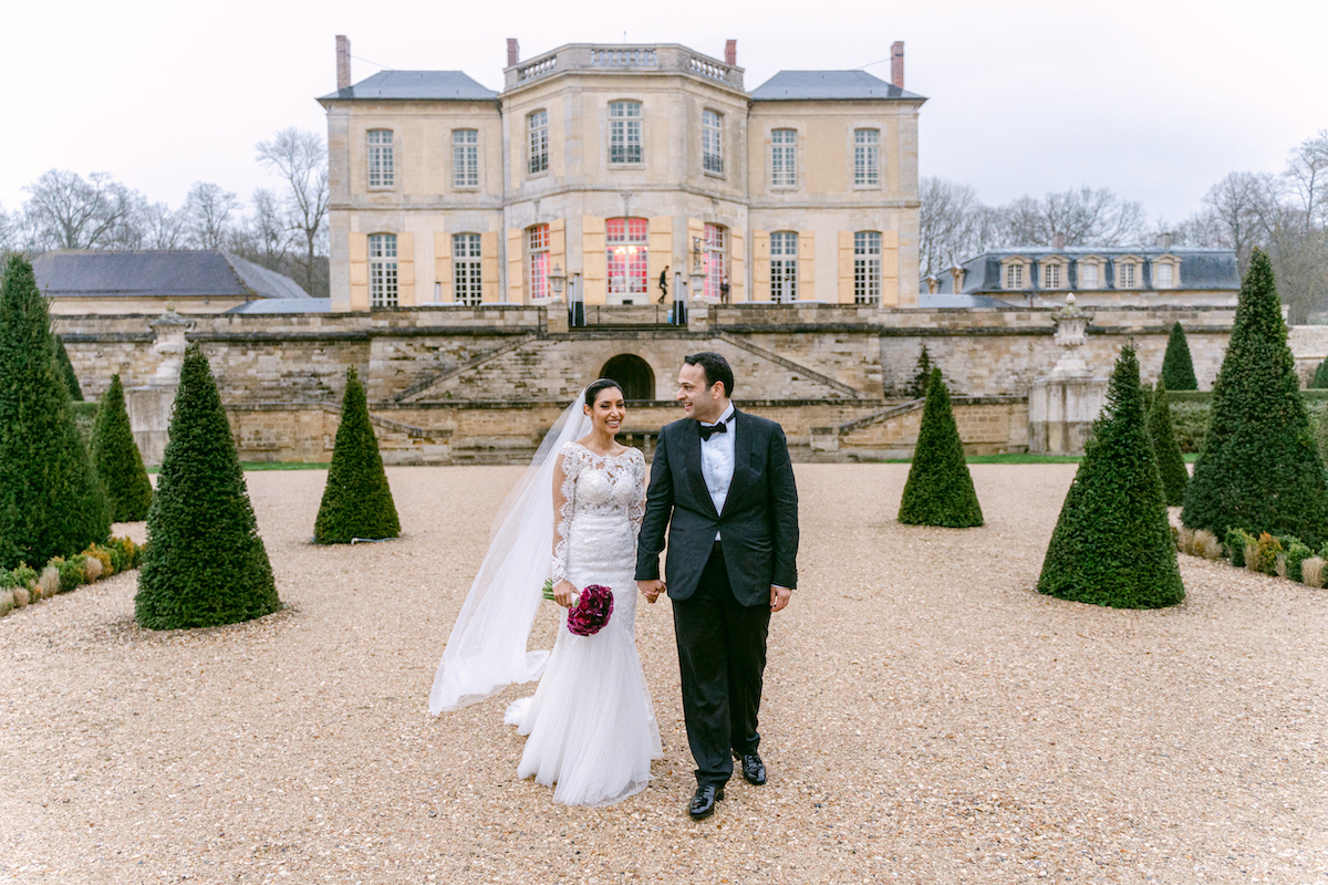 Arabic wedding couple in front of Paris countryside chateau
