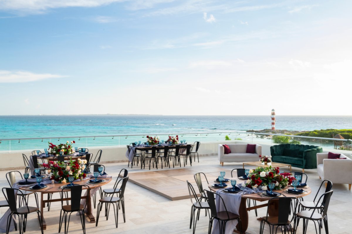 Hyatt Ziva Cancun reception setup on rooftop with lighthouse in the background