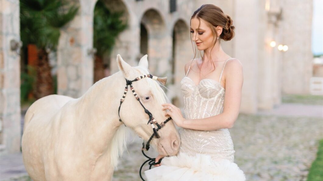 bride pets miniature white horse