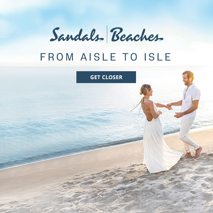 Destination wedding couple on the beach wearing all white