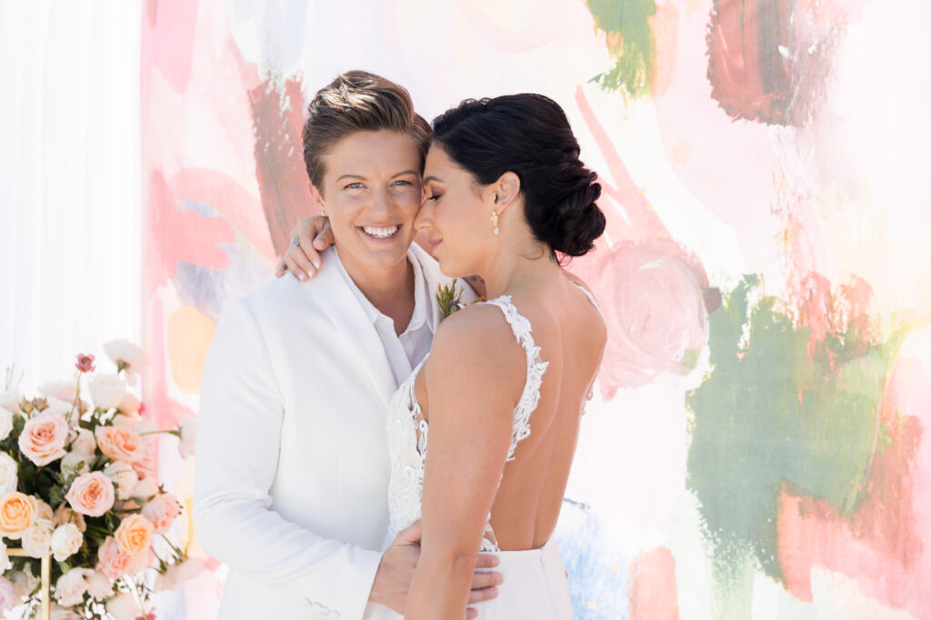 wedding in aruba with two women embracing