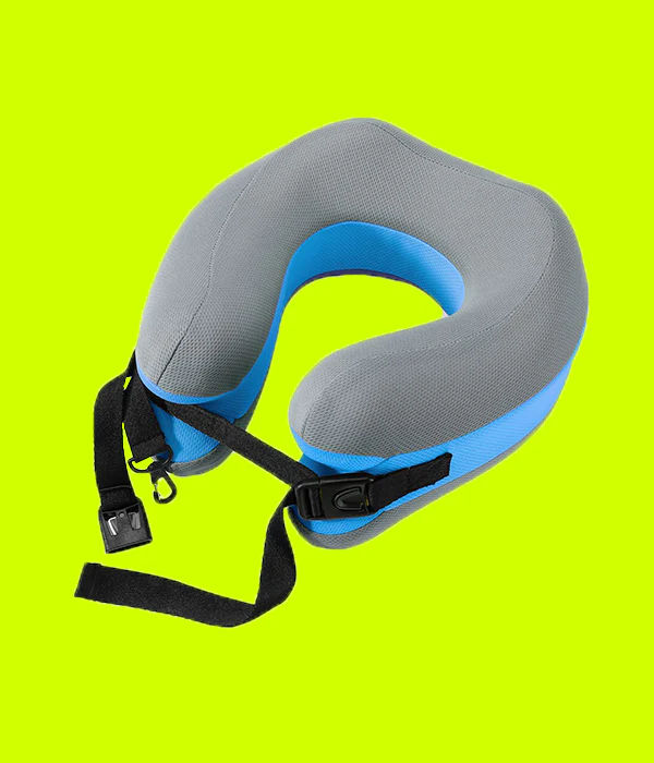 A gray and blue travel neck pillow with black adjustable straps and buckles, set on a bright yellow background.