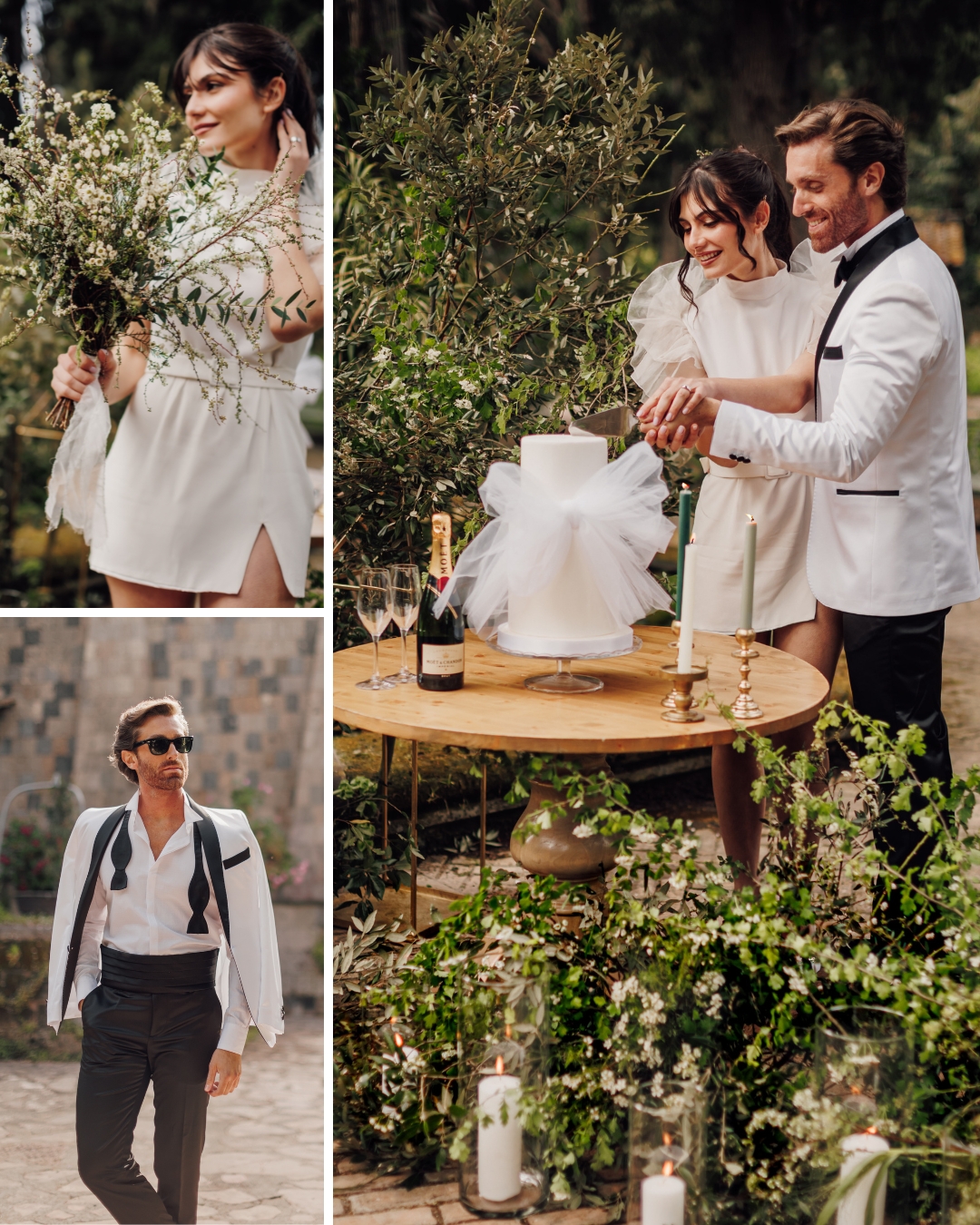 A couple in white attire celebrates their outdoor wedding with a cake-cutting ceremony. The bride holds a bouquet, and the groom poses with an open jacket. The setting features greenery and decorative candles.