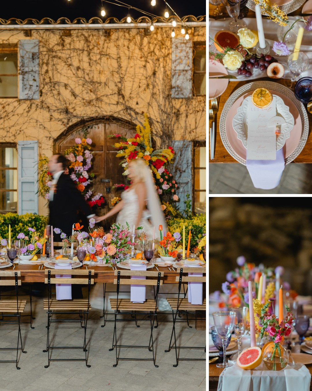 A couple walks past a rustic dining table adorned with colorful flowers, candles, and plates. The table is set for an outdoor event against a vine-covered wall decorated with flowers.