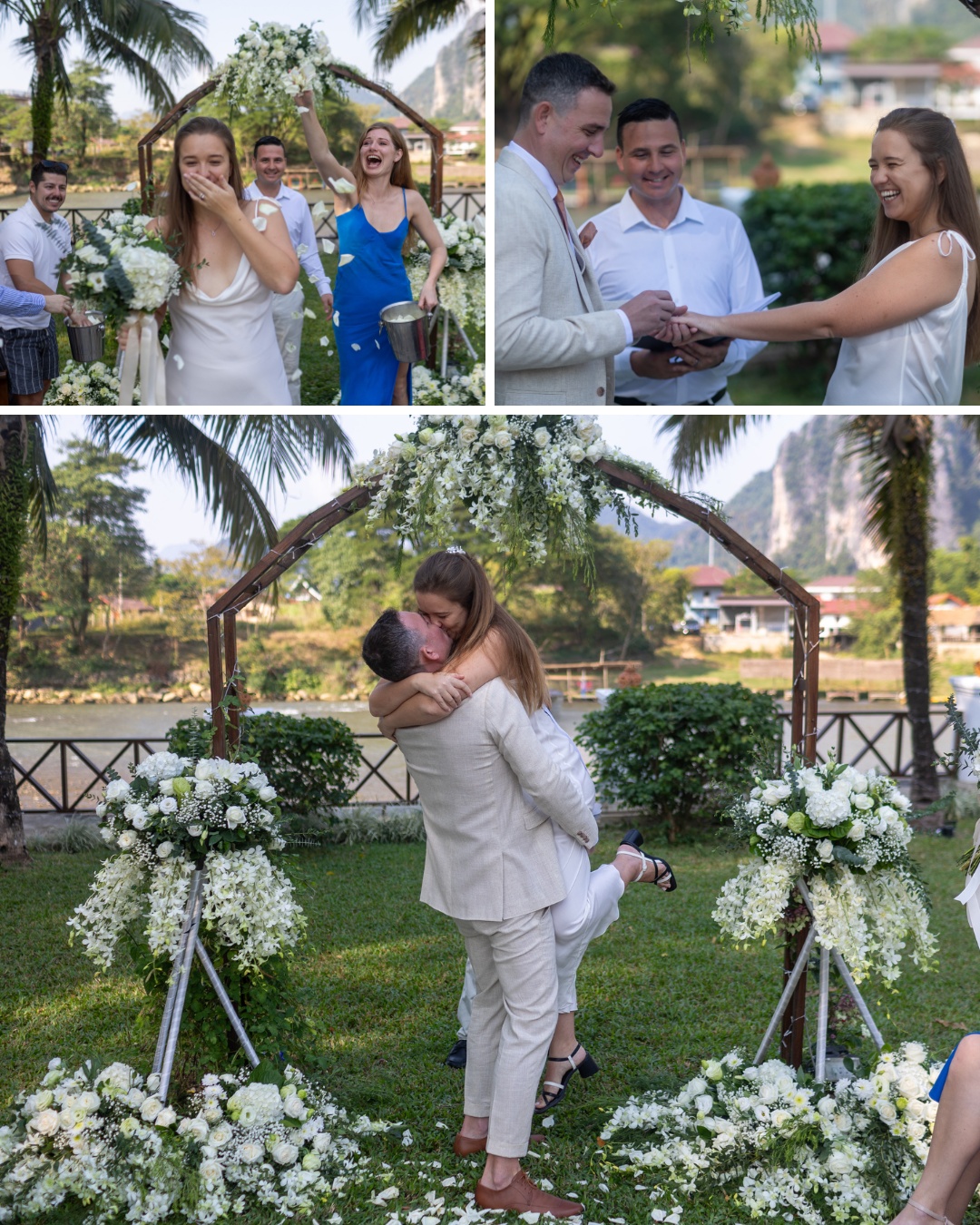 A couple is getting married outdoors under an arch decorated with white flowers. The bride is emotional, and guests are celebrating. The groom lifts the bride in a joyful embrace.