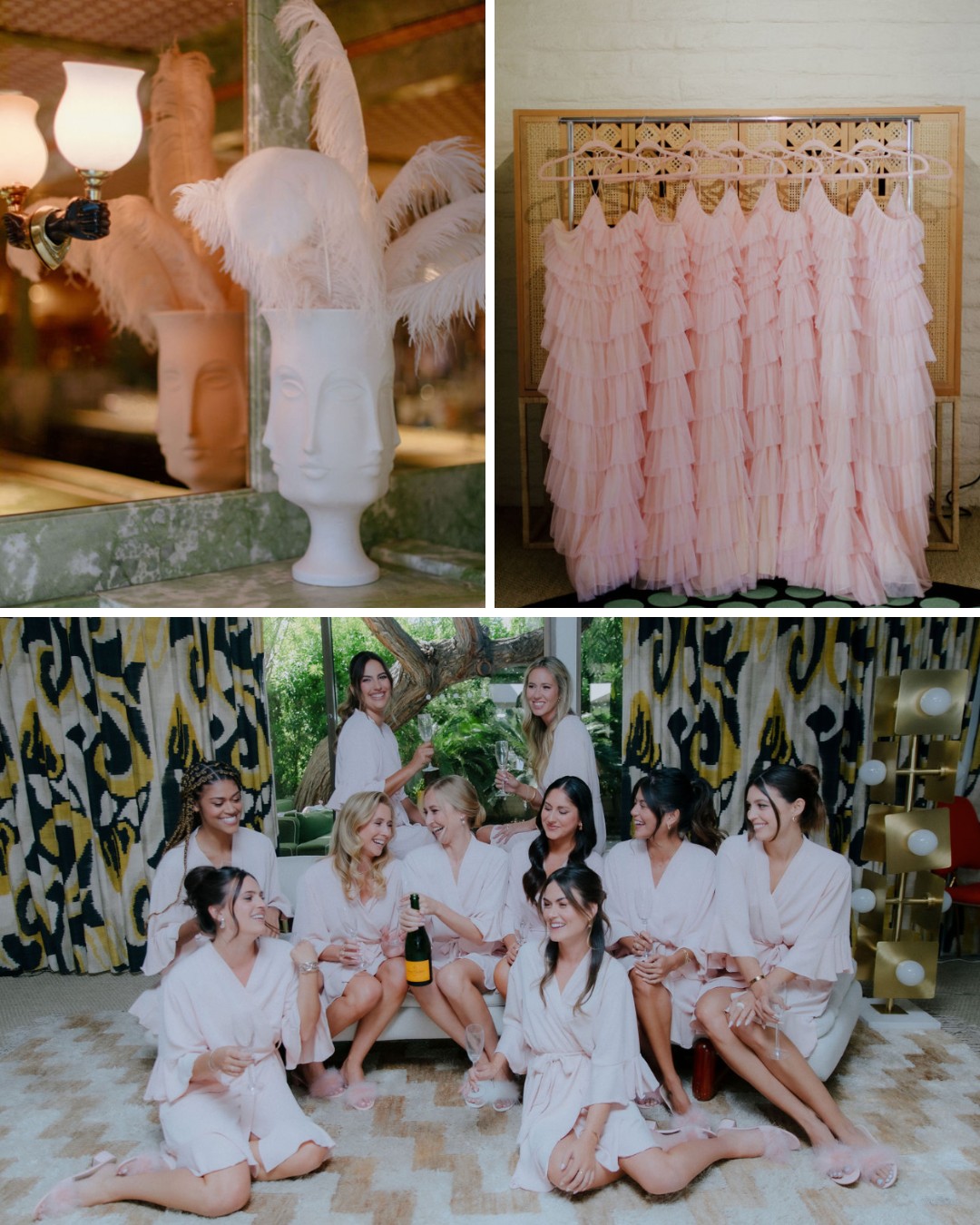 A group of women in matching robes sit and stand around a champagne bottle. Nearby are pink ruffled dresses on a rack and a decorative vase with feathers.