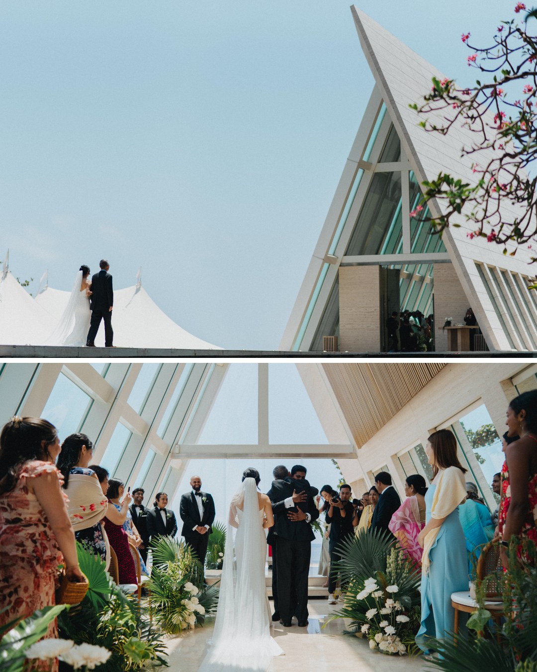 A wedding ceremony inside a modern, glass-paneled chapel; guests stand on either side while a couple faces the officiant at the altar.