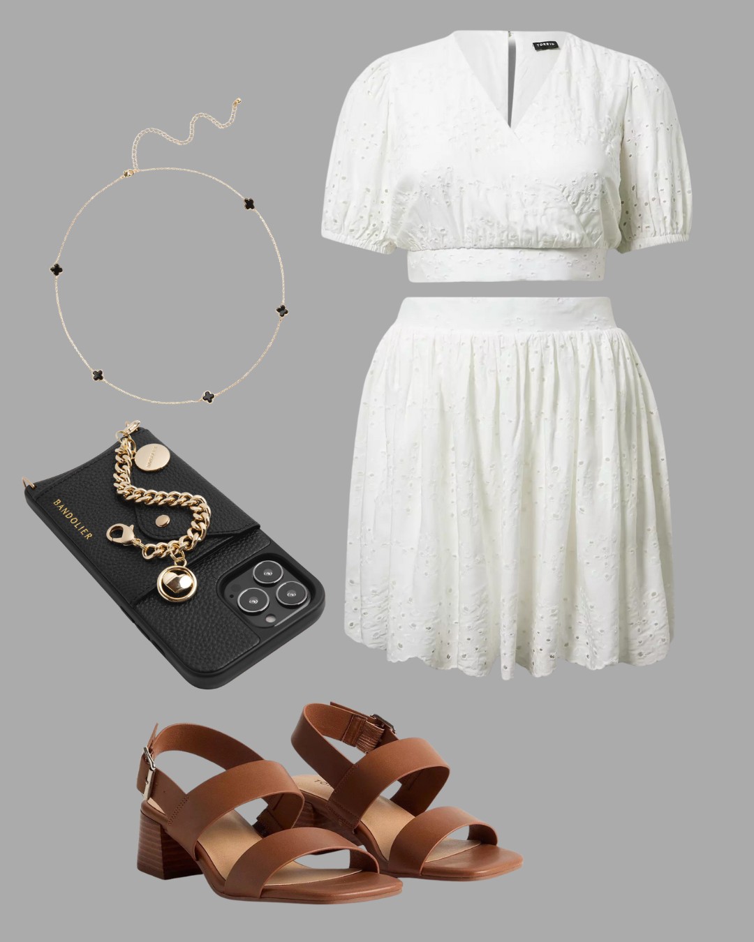 A white short-sleeve dress, tan heeled sandals, a gold necklace, a black phone with a gold chain accessory, all arranged on a gray background.