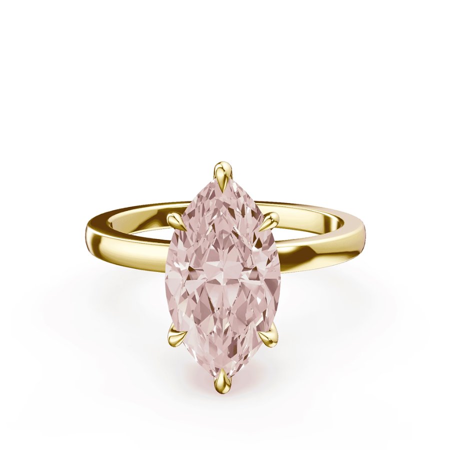 A gold ring featuring a marquise-cut light pink gemstone set vertically with six prongs.