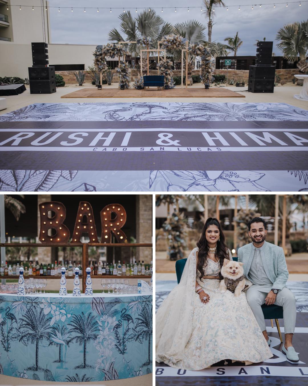 Outdoor wedding setup with a large personalized dance floor, a decorated bar area, and a couple in traditional attire posing with a small dog.
