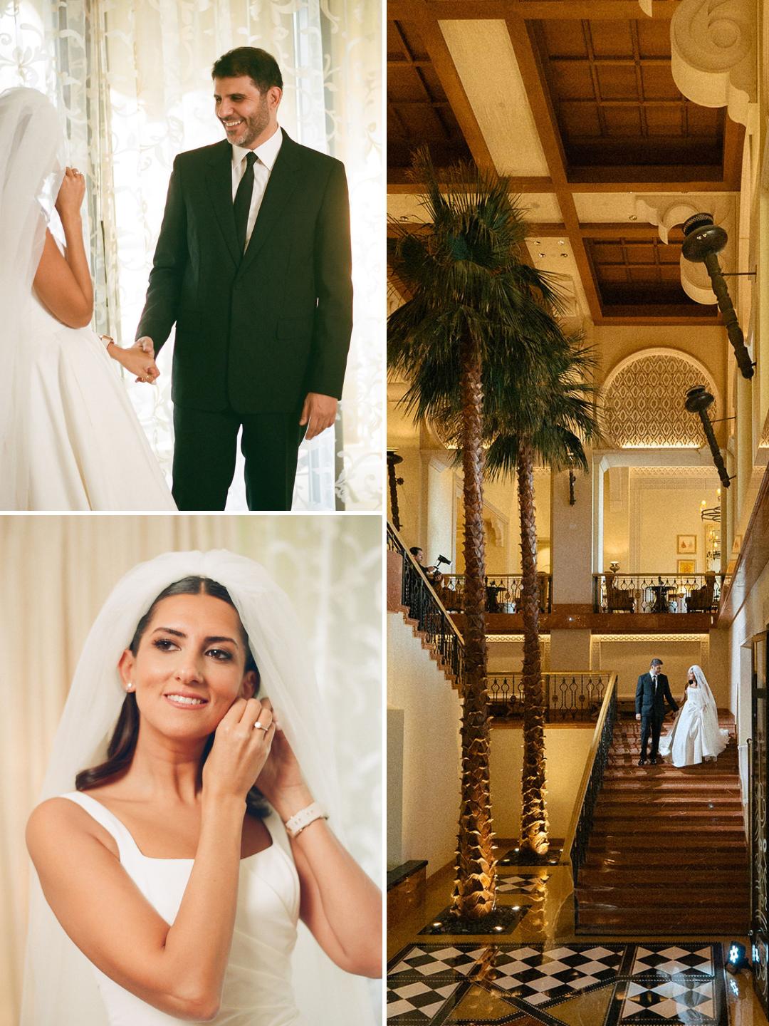 A bride and groom hold hands, the bride adjusts her earring, and the couple walks up an elegant staircase with palm trees in a grand, well-lit venue.