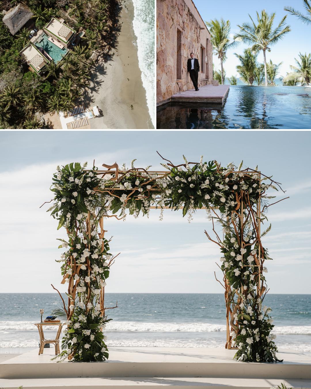 Aerial view of beachside cabanas, a man by a pool near a stone building, and a floral arch on the sand with the ocean in the background.