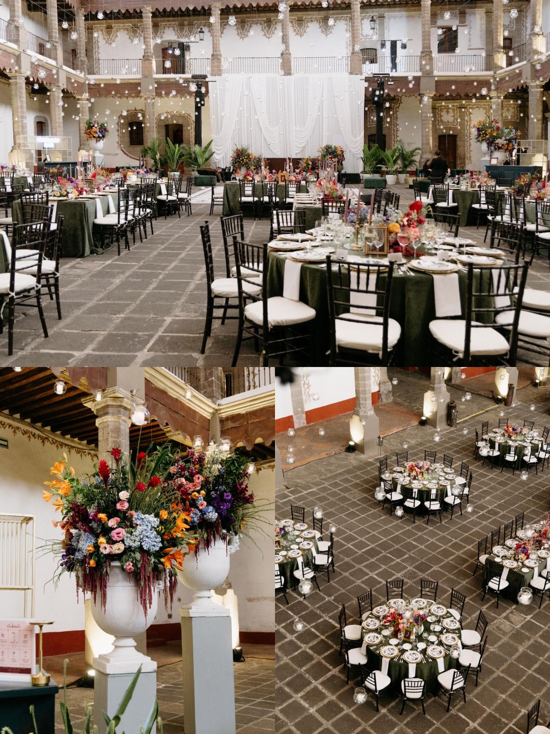Elegant event hall with round tables set for a formal gathering, featuring floral centerpieces, string lights, and a high ceiling with exposed beams.