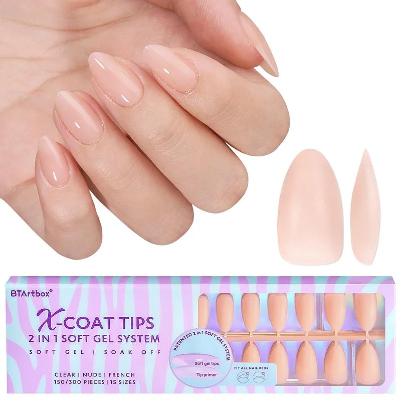 A hand with nude-colored gel nails is shown next to artificial nail tips and a box labeled "X-Coat Tips 2 in 1 Soft Gel System.