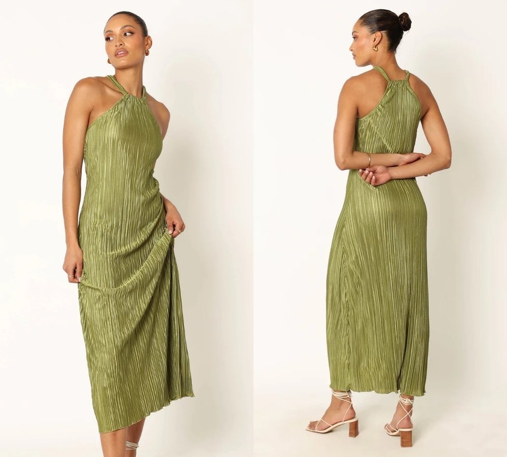 A woman models a sleeveless, olive green, pleated midi dress with a halter neckline, shown from the front and back. She wears strappy nude heels.