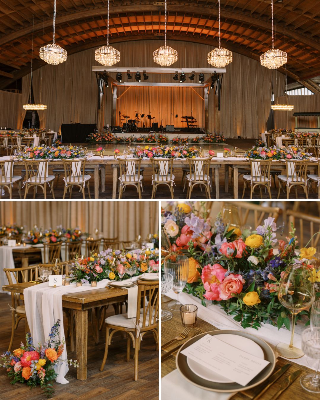A decorated event space features long tables with floral centerpieces, elegant table settings, and a stage with lighting under a wooden arched ceiling.