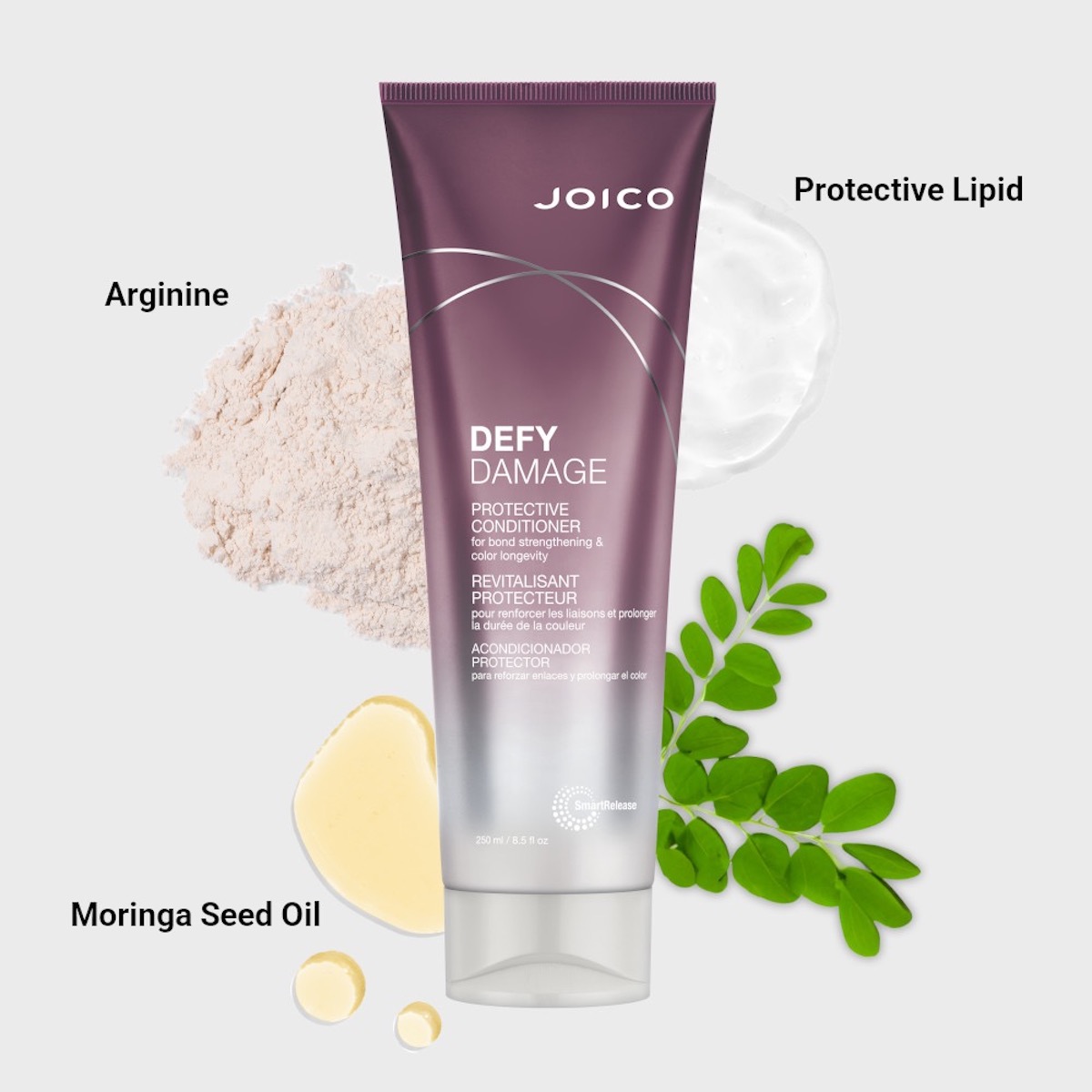 Tube of Joico Defy Damage Conditioner with labeled ingredients: Arginine powder, protective lipid cream, and moringa seed oil with leaves, displayed on a light background.