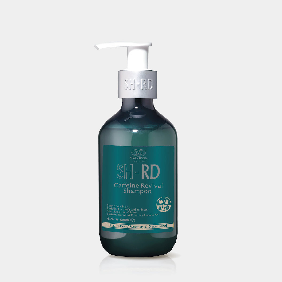 A dark green bottle of S.E.R.D. Caffeine Revival Shampoo with a silver pump dispenser against a plain light gray background.